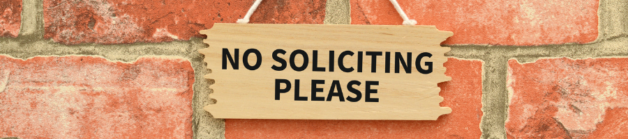 Hanging No Soliciting sign