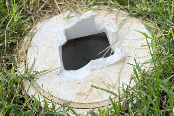 file photo of damaged cap on a yard cleanout